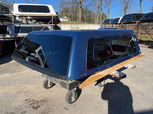Blue truck cap with wooden accents for GMC HD 82.2" PNT.