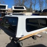 White truck cap for Ford SD 81.9" with tinted windows and aerodynamic design.
