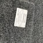 Chevy truck part label on textured surface in Summit White color.