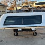 Chevy truck camper shell in Summit White for pickup trucks.