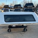 Chevy truck camper shell in summit white with tinted window.