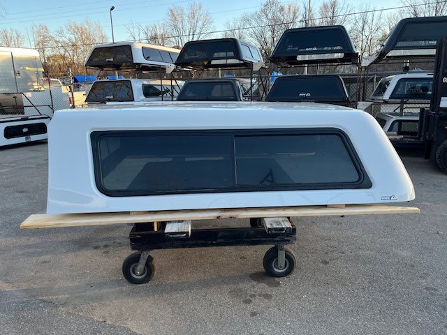 Chevy truck camper shell in summit white with tinted window.