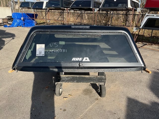 Black truck bed cover for Chevy HD 82.2" with side windows and rear window.