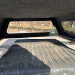 Truck bed cover with black rubber mat for Chevy HD 82.2" model.