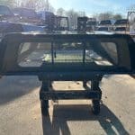 GMC 1500 truck bed with canopy and side rails for pickup truck.
