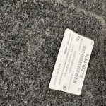 Vehicle cap color tag on textured surface for Chevy 1500 truck.