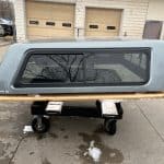 Camp and Cruise Chevy 1500 truck cap with window in Sharkskin color.