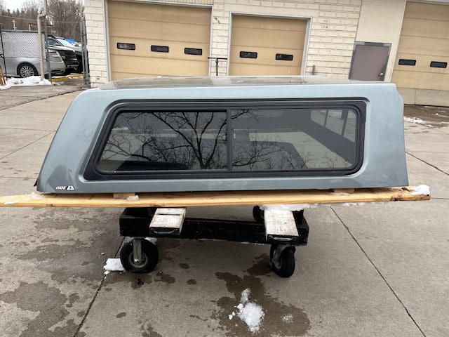 Camp and Cruise Chevy 1500 truck cap with window in Sharkskin color.