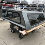 Camp and Cruise Chevy 1500 truck cap in Sharkskin color with tinted windows.