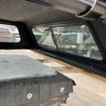 Camp and Cruise truck bed cap for Chevy 1500 in Sharkskin color.