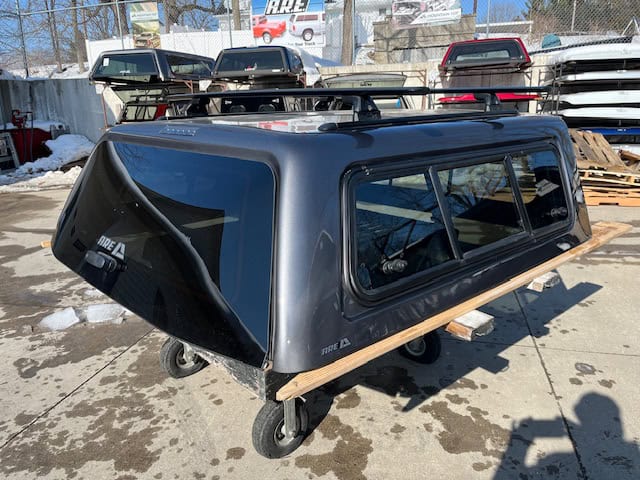 Gray truck bed cap for F150 with color code M7, durable and weather-resistant.