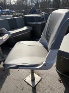 Boat seat at Camp & Cruise, outdoor setting, boat accessories visible.
