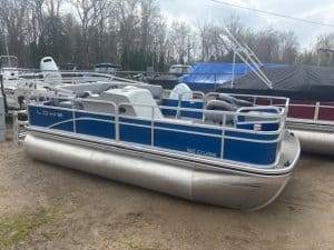 Pontoon boat with blue and silver exterior at Camp and Cruise, ideal for leisure and water activ.