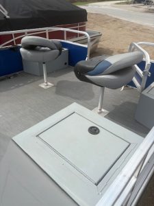 Aluminum boat seating with cushioned seats and deck hatch at Camp and Cruise. Perfect for fishin.