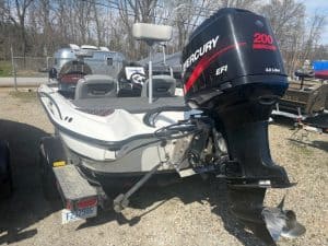 Boat with Mercury outboard motor at Camp and Cruise, outdoor display.