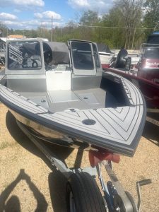 Boat at Camp & Cruise for water sports and boating activities.