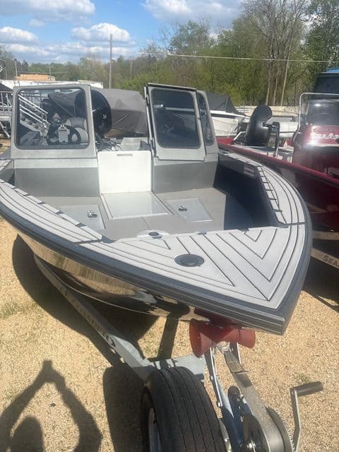 Boat at Camp & Cruise for water sports and boating activities.