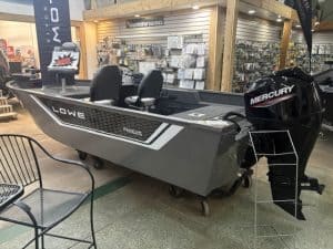 Lowe fishing boat with Mercury outboard motor displayed at Camp and Cruise.