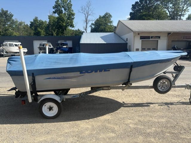 14-foot Lowe utility boat on trailer with cover, ideal for fishing and boating.