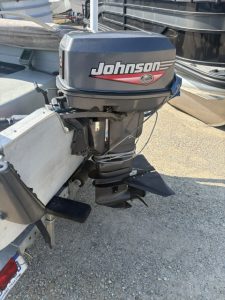 Johnson outboard motor attached to boat for fishing or recreation.