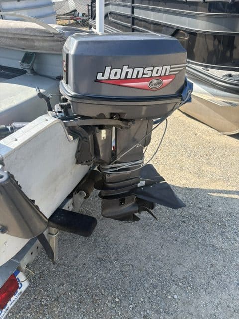 Johnson outboard motor attached to boat for fishing or recreation.