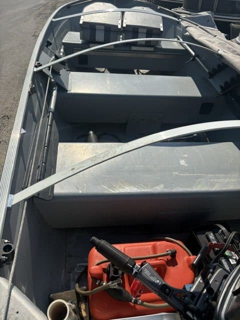14-foot Lowe utility boat with motor and interior details.