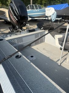 Lund 1600 SC boat with Mercury 50 outboard engine at marina.