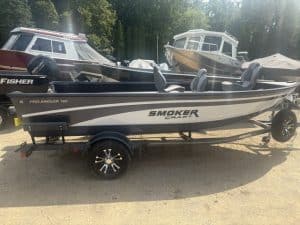 Smoker Craft Pro Angler 165 fishing boat on trailer at marina.