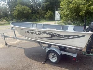 Starcraft aluminum boat on trailer ready for water.