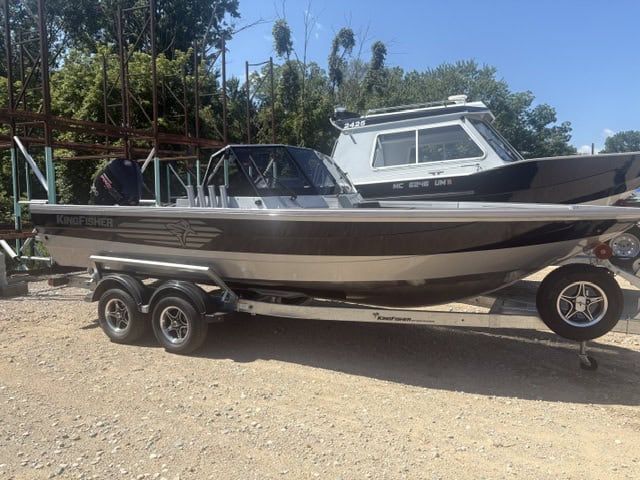 Kingfisher Arrow Sport boat on trailer at a boat yard.
