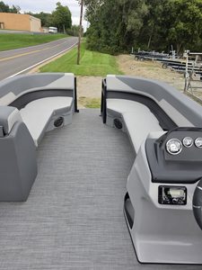 Lowe LS 210 Tri-Toon boat interior with seating and steering console.