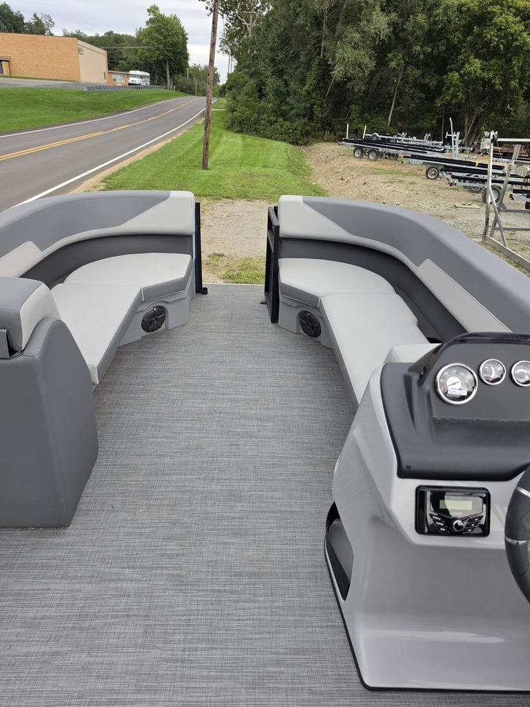 Lowe LS 210 Tri-Toon boat interior with seating and steering console.