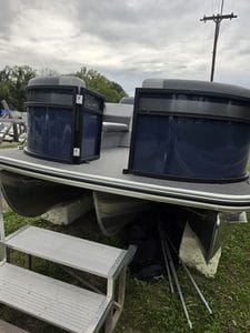 Lowe LS 210 Tri-Toon boat with Mercury 150 Pro XS engine on a trailer.