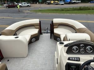 Comfortable boat seating with steering console on Lowe SS190 pontoon boat.