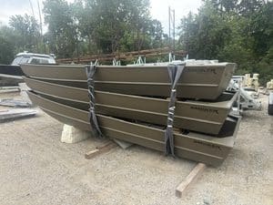 Stacked Smoker Craft 1648 Jon Boats ready for delivery or storage.