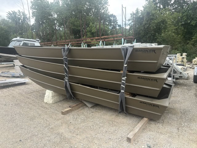 Stacked Smoker Craft 1648 Jon Boats ready for delivery or storage.