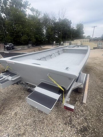 Gray Sea Ark 2072 MVJT boat on trailer with steps and open interior.