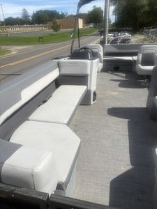Comfortable gray seating on Lowe LS210 pontoon boat for leisure and relaxation.