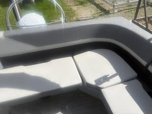 Comfortable boat seating area with cushions on Lowe LS210 boat.