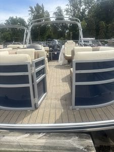 Lowe SS210 pontoon boat with beige seating and open deck for leisure activities.