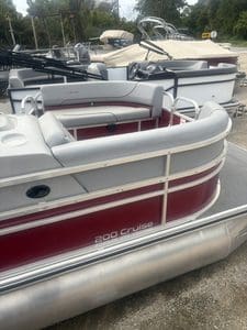 Lowe UC200 cruise pontoon boat with seating and safety features.