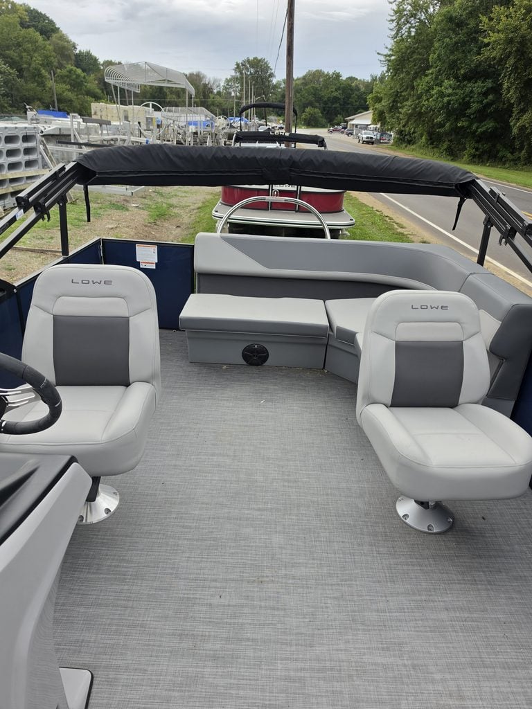 Lowe LS 210 Tri-Toon boat interior with seating and canopy.