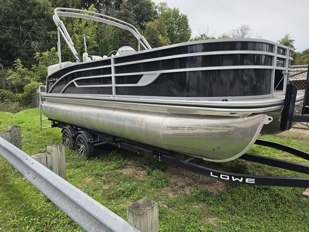 Lowe SF212WT pontoon boat with Mercury 115 engine on trailer.