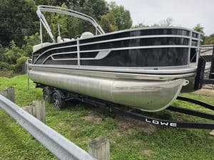 Lowe SF212WT pontoon boat with Mercury 115 engine on trailer.