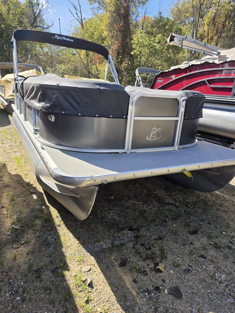 Misty Harbor Biscayne 2085 pontoon boat with Mercury 50 hp engine on display.