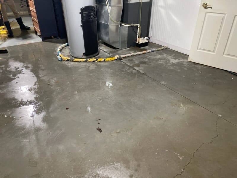 Cleaned concrete floor after water extraction in a garage.