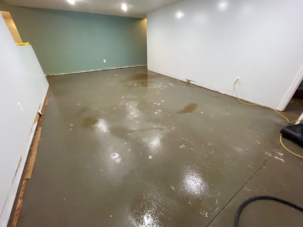 Cleaned and dried basement floor after water extraction service.