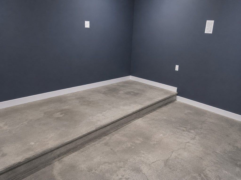 Cleaned concrete floor after water extraction in basement room.