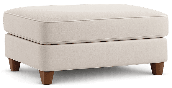 Clean and fresh upholstered ottoman in beige fabric with wooden legs.