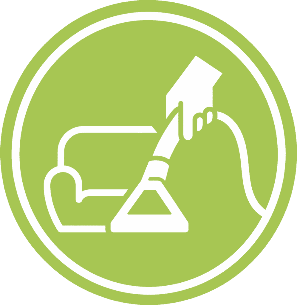 Professional upholstery cleaning with steam cleaner and hand tools.